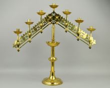 A VICTORIAN BRASS GOTHIC ECCLESIASTICAL SEVEN LIGHT CANDELABRUM, with ratchet fittings to both