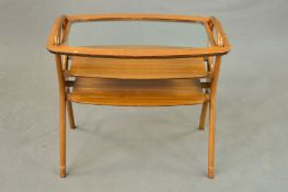 MALCOLM WALKER FOR DALESCRAFT, a 1950’s teak butlers tables with a removable glass top tray, above a