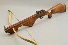 A FULL SIZE CROSSBOW, by Border Bows, Kelso, Scotland, fitted with a thumb hole stock