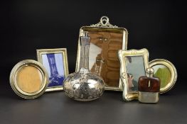 FIVE VARIOUS SILVER MOUNTED EASEL BACK PHOTOGRAPH FRAMES, three rectangular and two circular, the