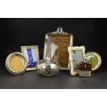 FIVE VARIOUS SILVER MOUNTED EASEL BACK PHOTOGRAPH FRAMES, three rectangular and two circular, the