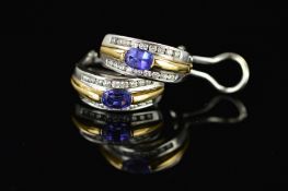 A MODERN PAIR OF TANZANITE AND DIAMOND OVAL HOOP STYLE EARRINGS, clip and post fittings,