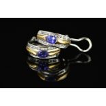 A MODERN PAIR OF TANZANITE AND DIAMOND OVAL HOOP STYLE EARRINGS, clip and post fittings,