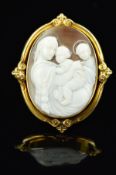 A LARGE OVAL SHELL CAMEO BROOCH, depicting two angels and a cherub classical scene, fitted to a