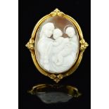 A LARGE OVAL SHELL CAMEO BROOCH, depicting two angels and a cherub classical scene, fitted to a