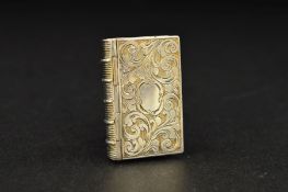 A VICTORIAN SILVER NOVELTY VINAIGRETTE, of book form, foliate engraved decoration to exterior, blind