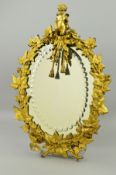 A LATE 19TH CENTURY ORMOLU WALL MIRROR, of oval form, the oval bevel edged plate with a border of