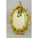A LATE 19TH CENTURY ORMOLU WALL MIRROR, of oval form, the oval bevel edged plate with a border of