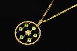AN EARLY 20TH CENTURY PERIDOT AND SEED PEARL BELLE EPOQUE PENDANT, circular form centring on a