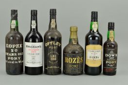 FIVE BOTTLES OF PORT AND A BOTTLE OF MADEIRA, comprising a bottle of Cossart Gordon Bual 5 year old,