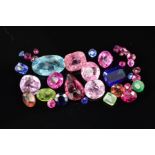 A MIXED GEMSTONES COLLECTION, to include a variety of garnets, sapphires, rubies, tourmalines,