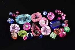 A MIXED GEMSTONES COLLECTION, to include a variety of garnets, sapphires, rubies, tourmalines,