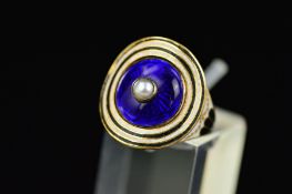 A GEORGIAN GOLD RING, set with latter added Victorian blue enamelled disc with a pearl centre,