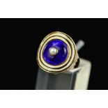 A GEORGIAN GOLD RING, set with latter added Victorian blue enamelled disc with a pearl centre,