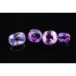 FOUR MAUVE/PURPLE VARI-CUT SAPPHIRES, one old cushion cut 7.8mm x 5.8mm, weighing 2.33ct, please