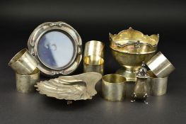 A SET OF SEVEN WHITE METAL GERMAN PLAIN CIRCULAR NAPKIN RINGS, engraved with numbers ranging from