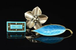 THREE SCANDINAVIAN DESIGNER BROOCHES, the first a light blue guilloche enamel leaf by Meka, the