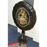 A VICTORIAN PAPIER MACHE TILT TOP TEA TABLE, of a shaped oval form, black lacquered mother of