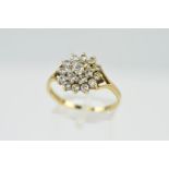 A 9CT GOLD CUBIC ZIRCONIA DRESS RING, designed as a tiered cluster of circular, colourless cubic