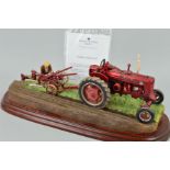 A BORDER FINE ARTS FIGURE GROUP FROM TRACTORS SERIES, 'Making Adjustments' (Farmall McCormick