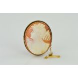 A MID TO LATE 20TH CENTURY OVAL SHELL CAMEO BROOCH, depicting a maiden in profile, measuring