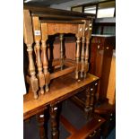 AN OAK NEST OF THREE COFFEE TABLE, another nest of three table and an oak linenfold single door