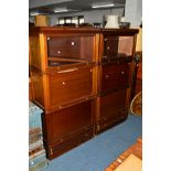 TWO EDWARDIAN MAHOGANY THREE SECTION BOOKCASES, each bookcase with a single glazed fall front