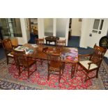 AN EDWARDIAN OAK WIND OUT DINING TABLE with two additional leafs, extended width 215cm x closed