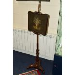 A VICTORIAN ROSEWOOD POLE SCREEN, the panel with needlework decoration depicting still life,