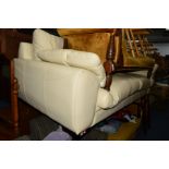 A CREAM LEATHER THREE SEATER SETTEE