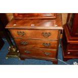 A SMALL REPRODUCTION WALNUT GEORGIAN STYLE CHEST of three long drawers, width 59cm x depth 38cm x