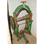 A VICTORIAN PAINTED CAST IRON MANGLE and a water pump (s.d) (2)