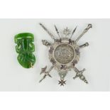 A COIN BROOCH AND A NEPHRITE MAORI JADE TIKI PENDANT, the brooch designed with a central 1796 F.