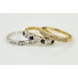 THREE MODERN GEM SET DRESS RINGS to include a 9ct gold pave diamond set eternity ring, ring size
