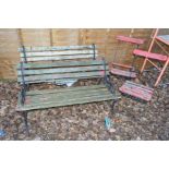 TWO WROUGHT IRON SLATTED GARDEN BENCHES, together with two similar folding chairs (4)