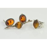 THREE ITEMS OF GEM JEWELLERY to include a tiger's eye bar brooch, length 50mm, a pair of modified