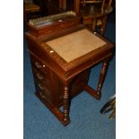 AN EDWARDIAN MAHOGANY DAVENPORT, the top fitted with a brown leather insert above four various