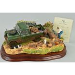 A BOXED LIMITED EDITION BORDER FINE ARTS FIGURE GROUP, 'Clearing the Way' (2006 Land Rover), No69/