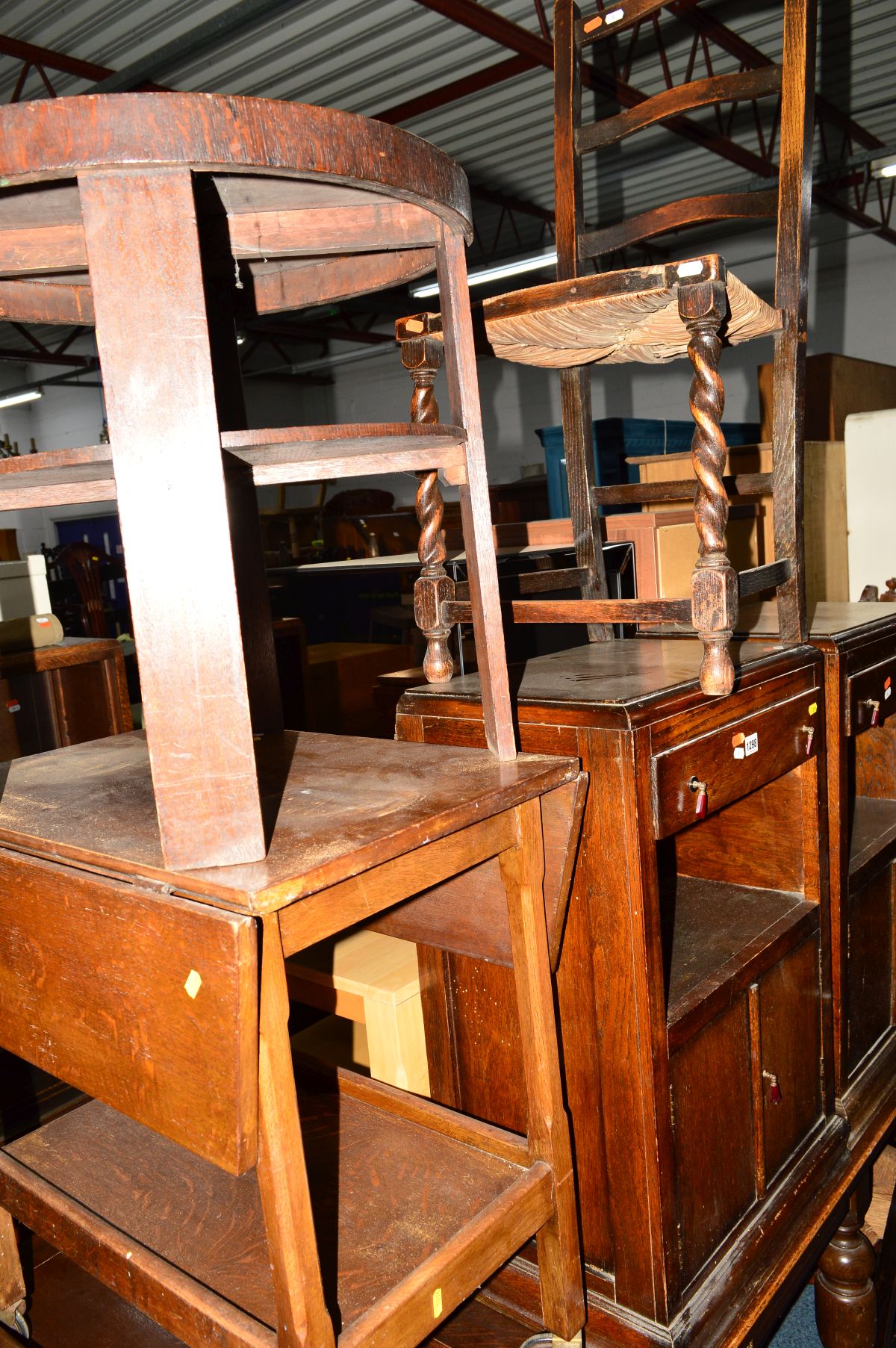 A PAIR OF OAK BEDSIDE CABINETS with single drawers, an Edwardian mahogany stool, an oak tea trolley,