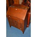 AN OAK FALL FRONT BUREAU with a single drawer