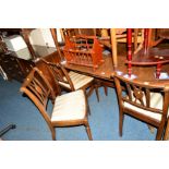 A REPRODUCTION MAHOGANY EXTENDING DINING TABLE, six chairs, a similar sideboard with four drawers,