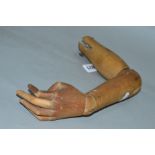 AN ARTICULATED WOODEN LEFT HAND AND ARM, from an artist model, signs of wear and minor damage to