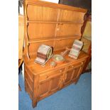 AN ERCOL ASH DRESSER, with two drawers and double cupboard doors, width 122cm x depth 47cm x