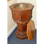 AN OAK ECCLESIASTICAL FLOOR STANDING OCTAGONAL FONT, with the removable lid revealing a brass