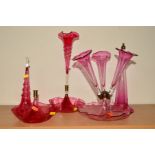 A CRANBERRY GLASS EPERGNE, with four flutes, height 44cm (thread for screw in middle flute not