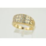 A 9CT GOLD DIAMOND DRESS RING, designed as three slightly graduated rows of brilliant cut diamonds