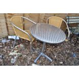 A ROUND STAINLESS STEEL GARDEN TABLE WITH TWO MATCHING CHAIRS (3)