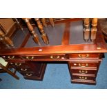 A REPRODUCTION MAHOGANY PEDESTAL DESK, with six various drawers and single door, width 122cm x depth