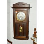 A 20TH CENTURY OAK WALL CLOCK