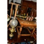 A VICTORIAN BRASS OIL LAMP with an etched glass shade, a reproduction coffee table and a plant stand